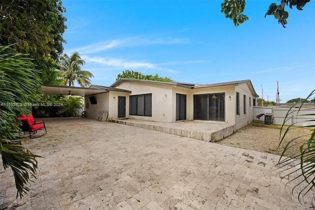 back of property featuring a patio area