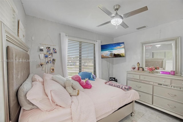 bedroom featuring ceiling fan and light tile patterned floors