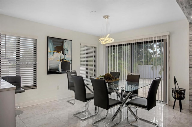 dining area with a notable chandelier