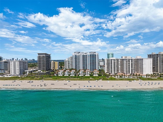 bird's eye view with a water view and a view of the beach