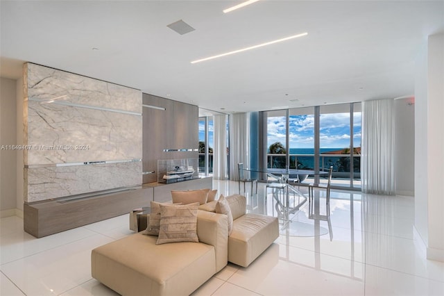 tiled living room with a wall of windows