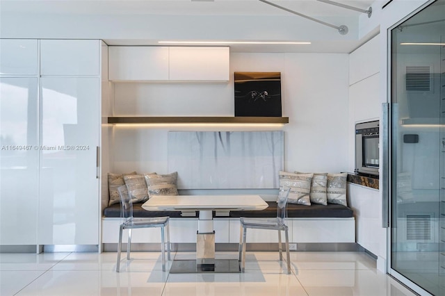 interior space featuring tile patterned flooring and breakfast area