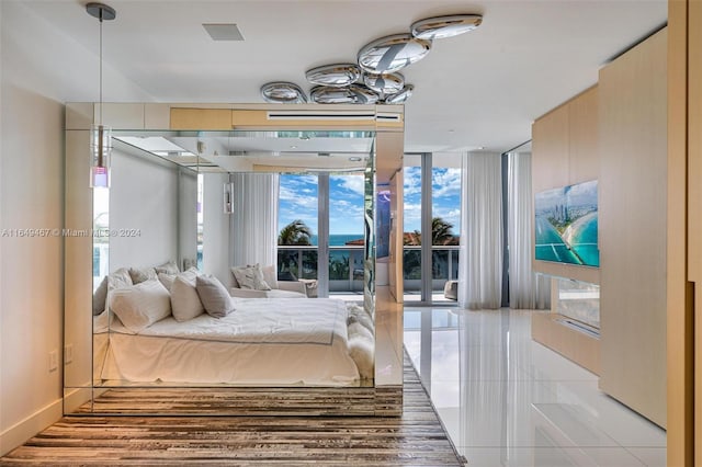 tiled bedroom with expansive windows