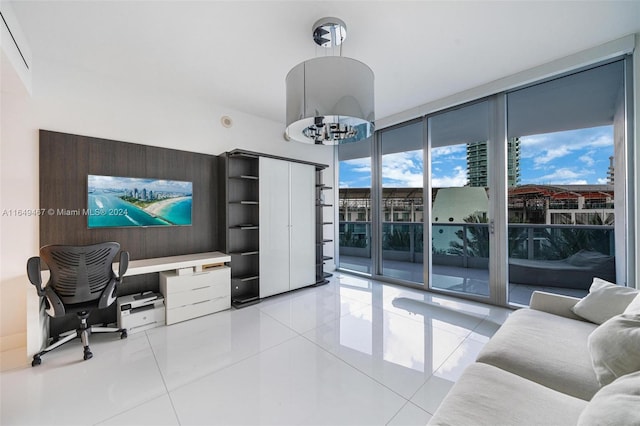 office with floor to ceiling windows, a notable chandelier, and light tile patterned flooring