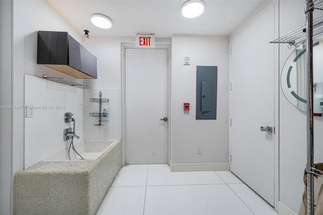 bathroom featuring electric panel and tile patterned floors