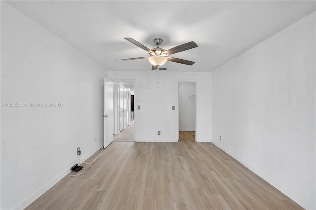 spare room featuring ceiling fan and light hardwood / wood-style floors