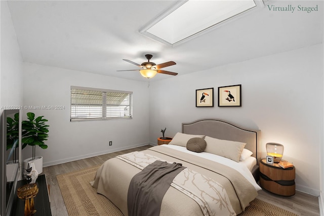 bedroom featuring light wood-type flooring and ceiling fan