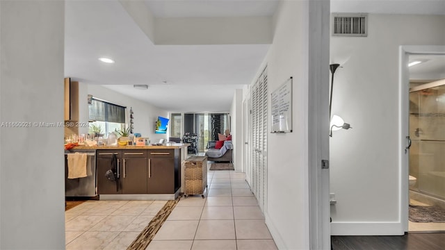 corridor with visible vents and recessed lighting