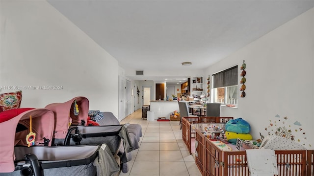 living area with light tile patterned flooring and visible vents