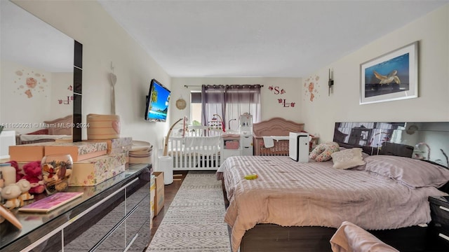 bedroom with wood-type flooring