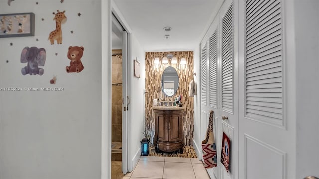 corridor with light tile patterned flooring