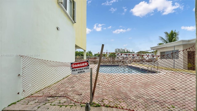 view of pool with fence