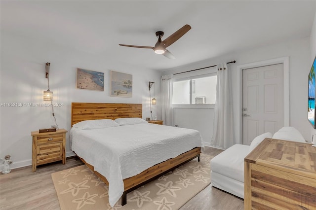 bedroom featuring light hardwood / wood-style flooring and ceiling fan