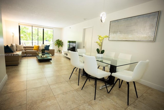 3300 NE 192nd St Unit 214, Aventura, FL 33180 - dining area featuring light tile patterned floors