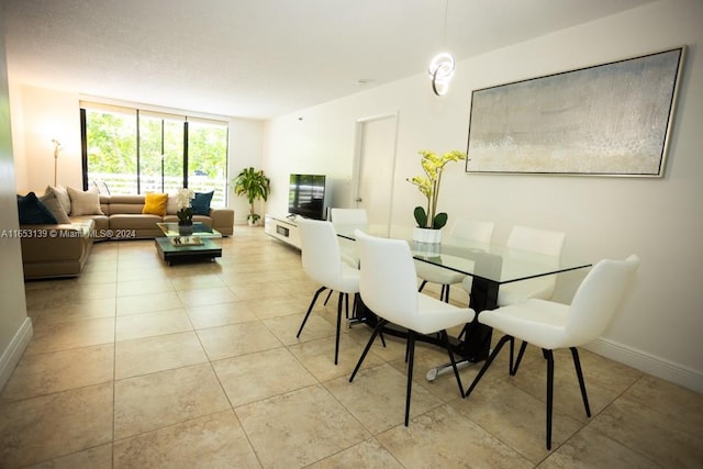 dining area featuring light tile patterned floors