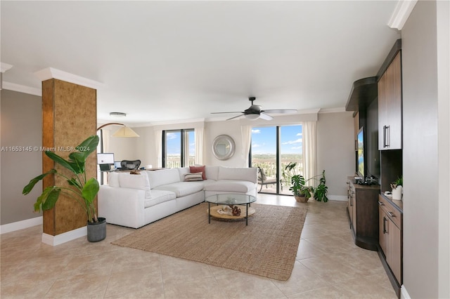 living room with light tile patterned floors, ornamental molding, and ceiling fan