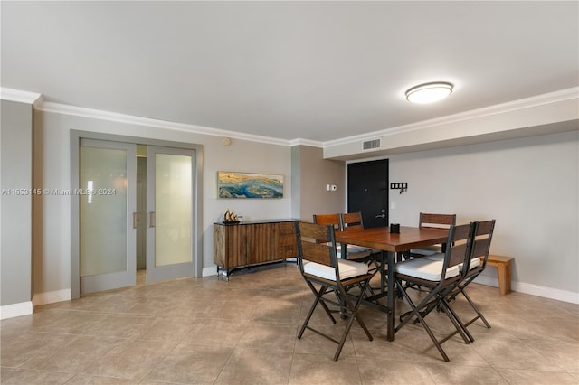 1500 S Ocean Dr Unit 15A, Hollywood, FL 33019 - dining space with visible vents, baseboards, light tile patterned flooring, and ornamental molding