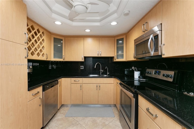 1500 S Ocean Dr Unit 15A, Hollywood, FL 33019 - kitchen with a sink, stainless steel appliances, light brown cabinets, tasteful backsplash, and recessed lighting