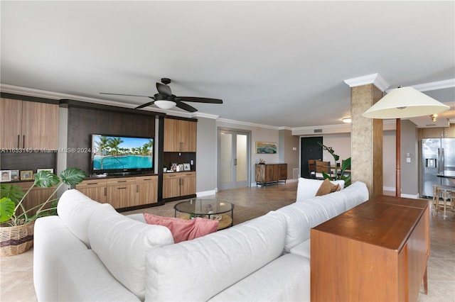 living room with ornamental molding, ceiling fan, and light tile patterned flooring