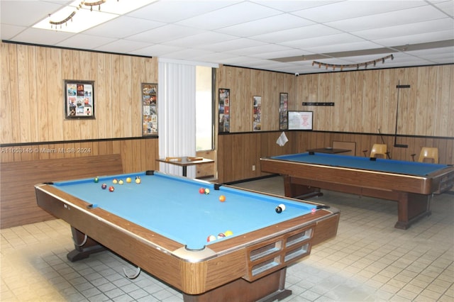 playroom with a drop ceiling, wood walls, and billiards