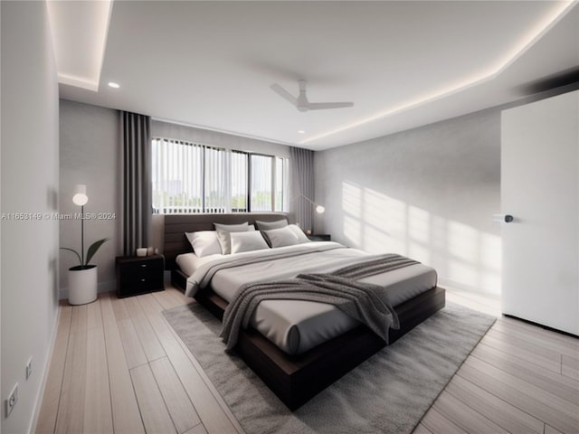 bedroom featuring ceiling fan and light hardwood / wood-style flooring