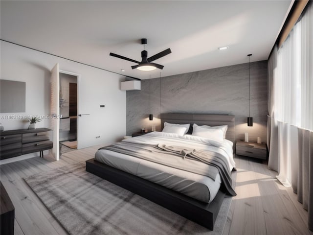 bedroom with light hardwood / wood-style flooring and ceiling fan