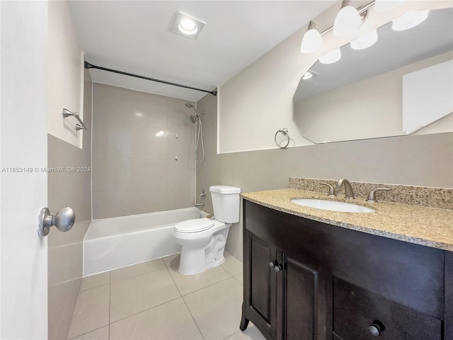 full bathroom with tile patterned flooring, vanity, toilet, and  shower combination