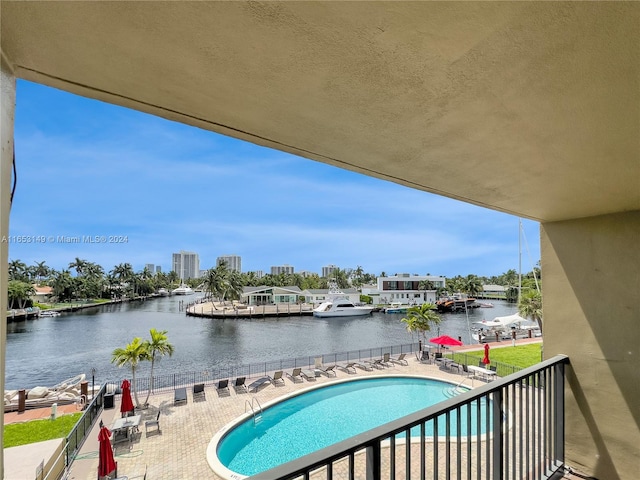 balcony with a water view and a patio area