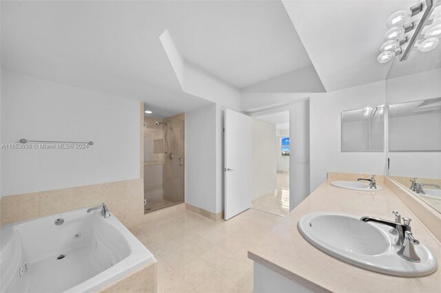 bathroom featuring tile patterned flooring, vanity, and independent shower and bath