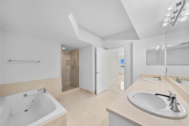 full bathroom featuring a stall shower, a sink, a whirlpool tub, and double vanity