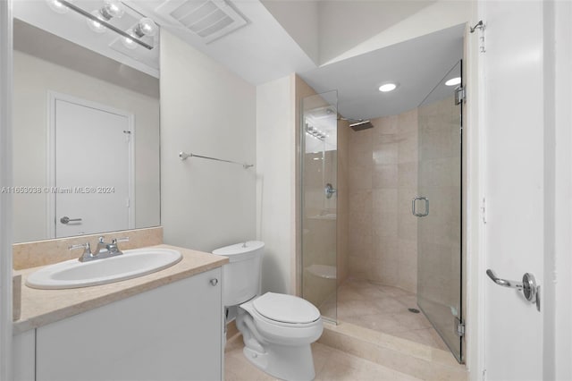 full bathroom featuring visible vents, toilet, a stall shower, vanity, and tile patterned flooring