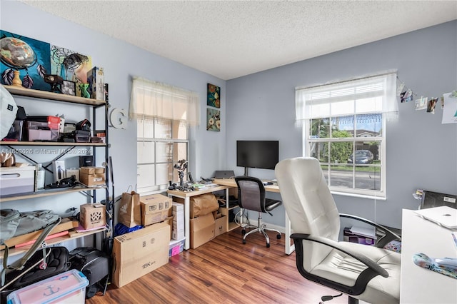 office space featuring hardwood / wood-style flooring and a textured ceiling