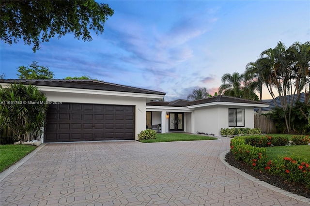 view of front of property with a garage