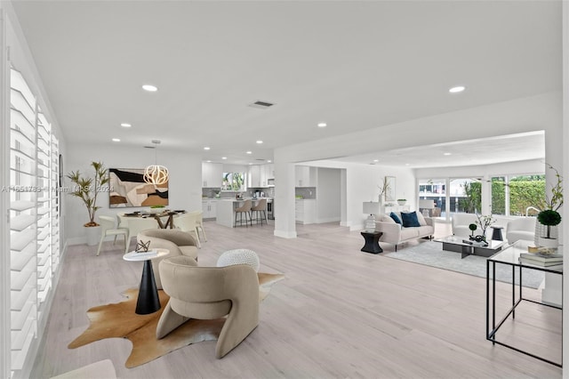 living room with light hardwood / wood-style flooring