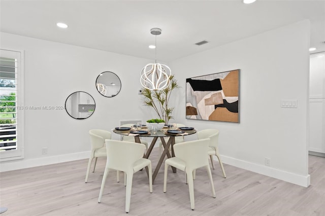 dining room with light hardwood / wood-style floors