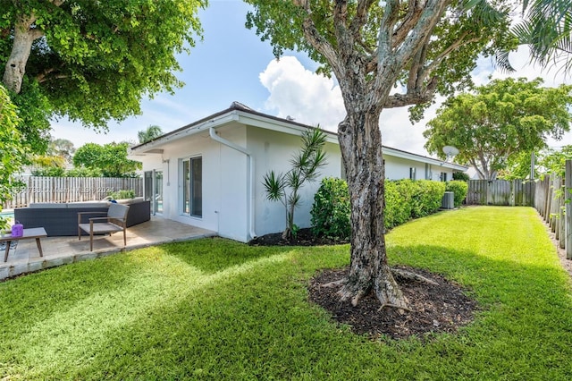 rear view of property featuring cooling unit, a patio area, an outdoor hangout area, and a yard