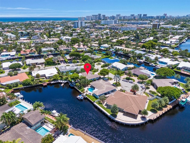 birds eye view of property with a water view