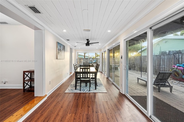 dining area with wood ceiling, crown molding, ceiling fan, and hardwood / wood-style flooring