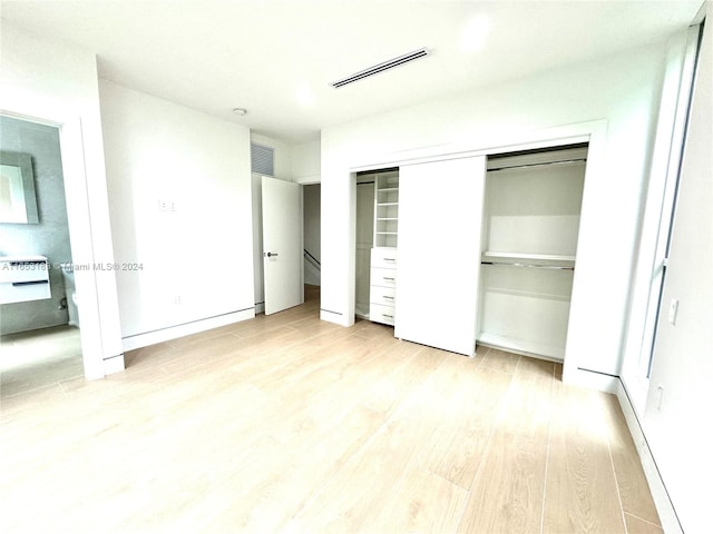 unfurnished bedroom featuring light hardwood / wood-style floors