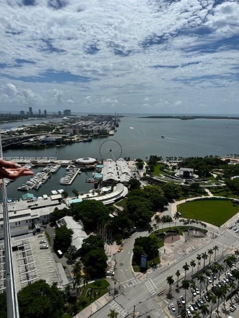 drone / aerial view featuring a water view and a city view