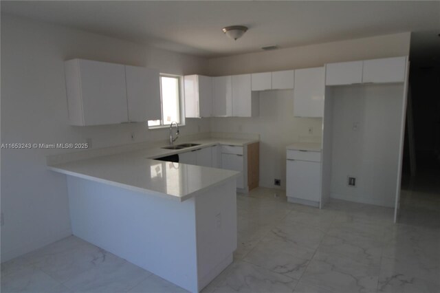 kitchen featuring white cabinetry