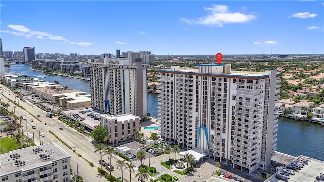 birds eye view of property with a water view