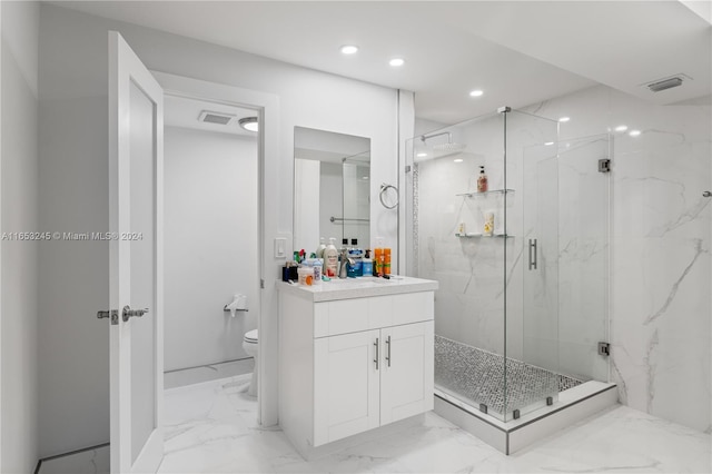 bathroom featuring vanity, toilet, and an enclosed shower