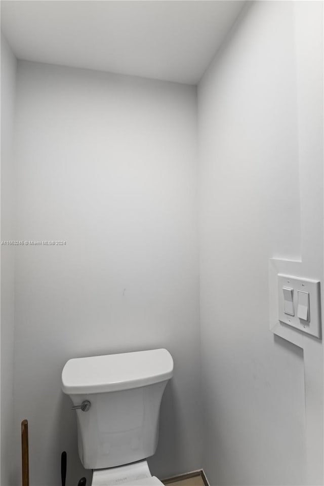 bathroom featuring toilet