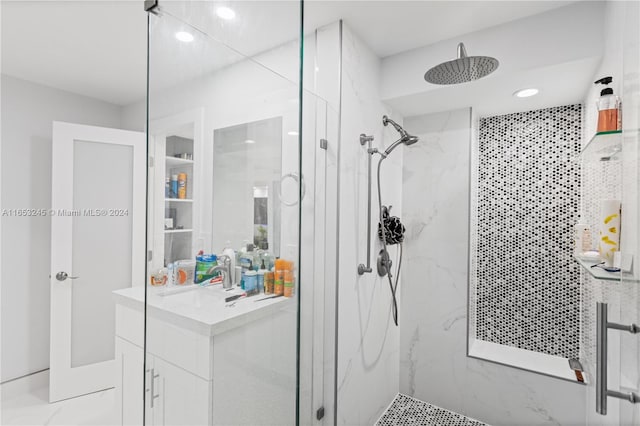 bathroom with an enclosed shower and vanity