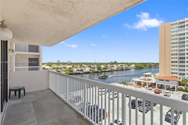 balcony featuring a water view