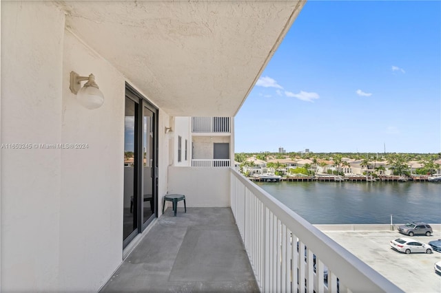 balcony featuring a water view