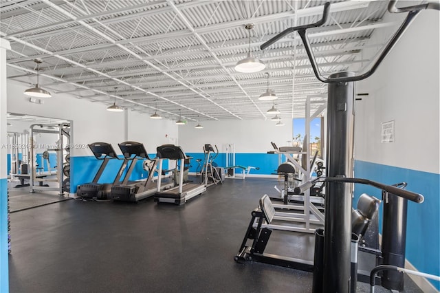 gym featuring rail lighting