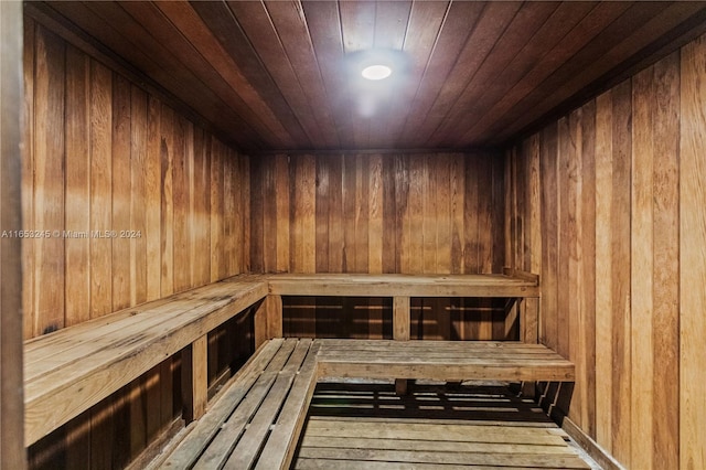 view of sauna featuring wooden ceiling and hardwood / wood-style flooring