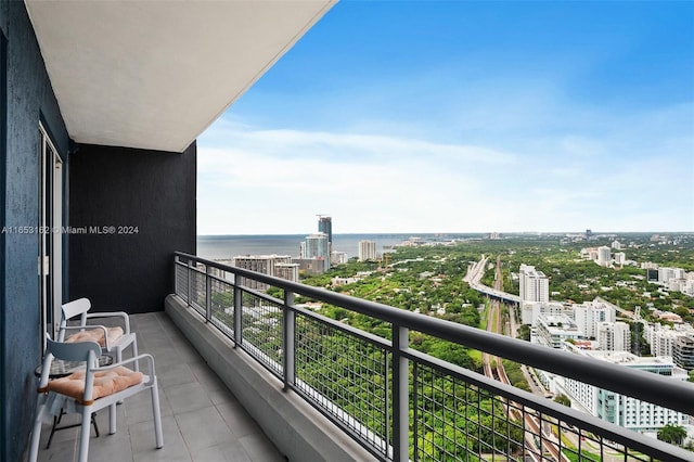 balcony featuring a water view